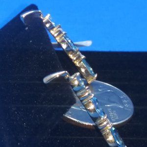 10 K Blue topaz earrings 1/15 ct.